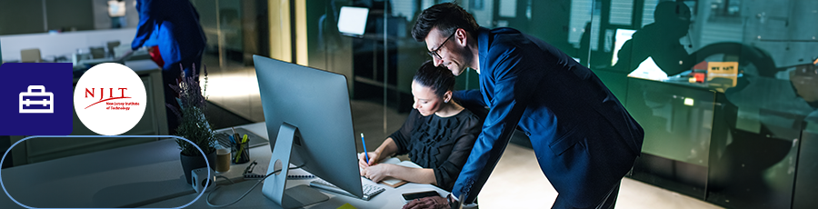 looking happy while standing over her shoulder and both look like they're Thriving in New Jersey's Diverse Tech Hub