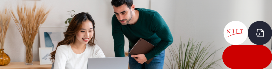 Two people working together with a laptop and a tablet in a modern office setting, NJIT logo visible